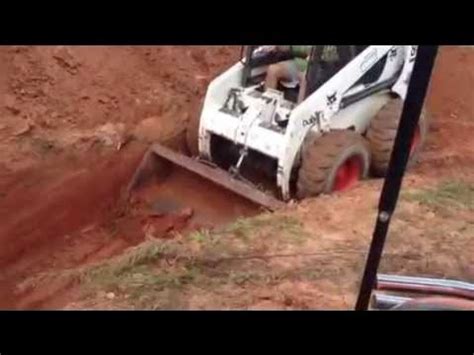 can you excavate with skid stear|digging holes with skid steer.